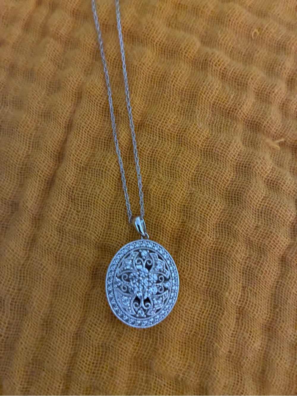 Zales Vintage style silver and white sapphire locket .